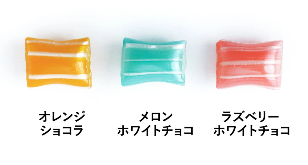 オレンジ、メロン、ラズベリーの3種類の縞模様のキャンディ